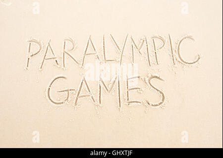 RIO DE JANEIRO - MARCH 20, 2016: Paralympic Games message written in the sand on Ipanema Beach. Stock Photo