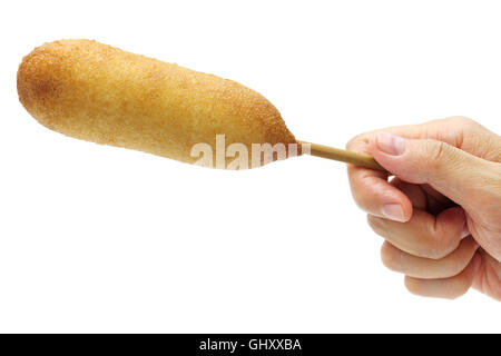 hand holding homemade corn dog isolated on white background Stock Photo