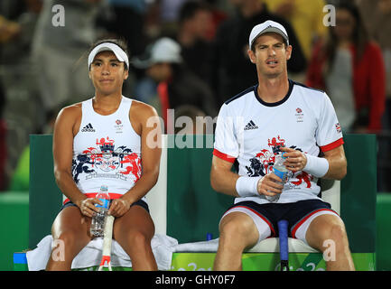 Great Britain's Heather Watson and Andy Murray take a water break during their Mixed Doubles First Round match on Centre Court at the Olympic tennis Centre on the sixth day of the Rio Olympic Games, Brazil. Stock Photo
