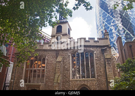 City of London   The medieval church of St Helen's Bishopsgate in the shadow of the Gherkin Stock Photo