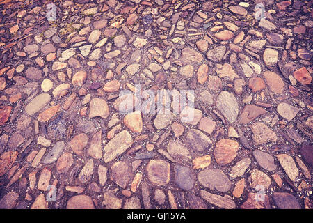 Vintage toned old street cobblestones background. Stock Photo