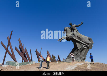 Tourists at statue of Antonio Maceo, on a sunny day at Plaza de la Revolucion, Santiago de Cuba, Cuba 2013 Stock Photo