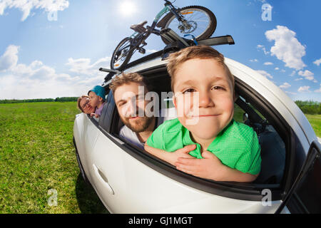 Portrait of happy boy travelling with his family Stock Photo