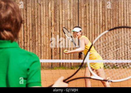 Tennis players playing a match on the clay court Stock Photo