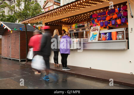 Fast food outlet selling chips at £4 a bucket on the Pier Head and Waterfront, in front of the Three Graces in Liverpool, Merseyside, UK Stock Photo