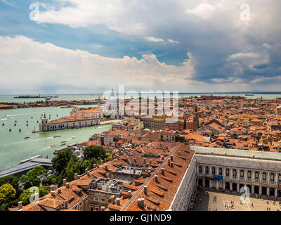 Aerial  view of of St Mark's square, with St Mark's Basin and the Dogana da Mar in the distance. Stock Photo