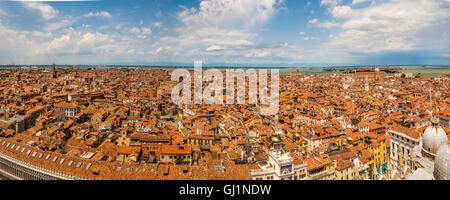 Aerial panoramic view of Venice, with St Mark's Square and the basilica domes in the foreground. Stock Photo