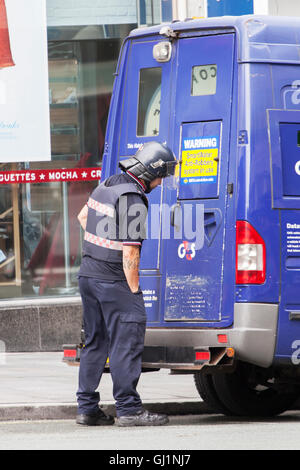 Secuirty Guard cash collection in Liverpool One, Merseyside, UK Stock Photo