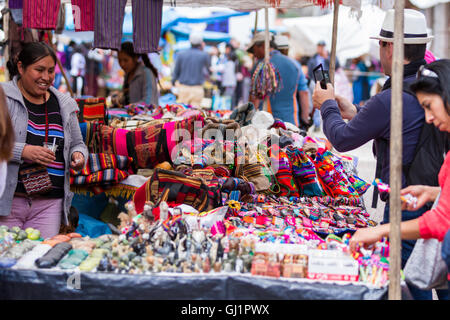 Pisac, Peru - May 15: Tourists shopping for souvenirs and local crafts at the Sacred Valley Market. May 15 2016, Pisac Peru. Stock Photo