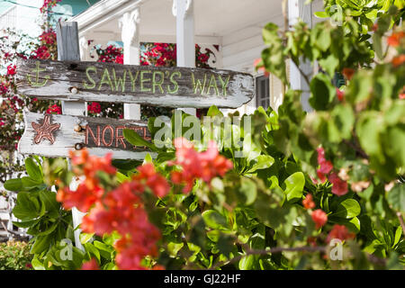 Quaint Street Signs in Hopetown. Colourful hand painted street signs on driftwood point the way in Hopetown on Elbow Cay. Stock Photo