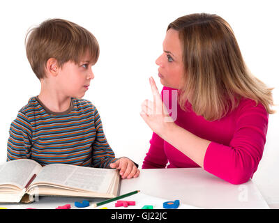 mother teaching her son Stock Photo