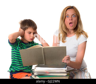 surprised mother trying to teach her son while he is confronting Stock Photo