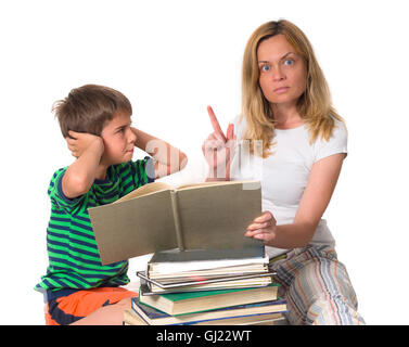 surprised mother trying to teach her son while he is confronting Stock Photo