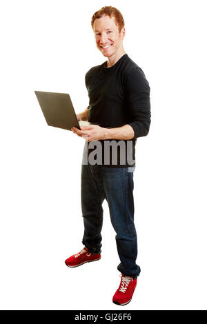 Webdesigner holding a computer and smiling content Stock Photo