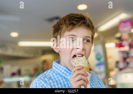Boy eating ice cream cone Stock Photo
