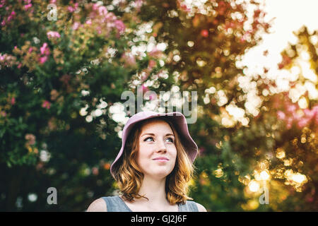 Woman wearing sunhat looking away smiling Stock Photo