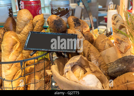 bread and rolls in wicker basket station in buffet line Stock Photo