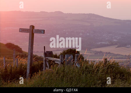 View from South Downs Way marker post near Firle Beacon at sunset. Stock Photo