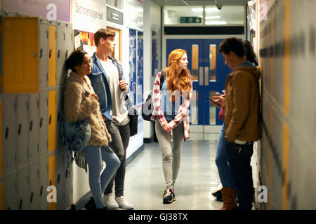 Five young adult students waiting in college locker room Stock Photo