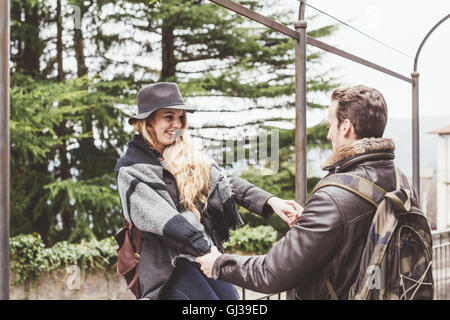 Young couple holding hands dancing, Lake Como, Italy Stock Photo