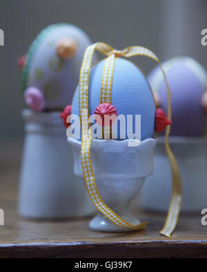Painted and decorated eggs in egg cups, close-up Stock Photo