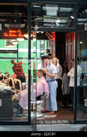BRIGHTON, June 14, 2016: A famous old style barber shop in Spitalfields narket, London, United Kingdom. Stock Photo