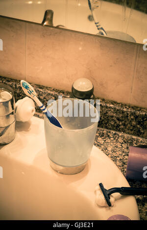 Bathroom sink in messy condition, a single male lifestyle concept Stock Photo