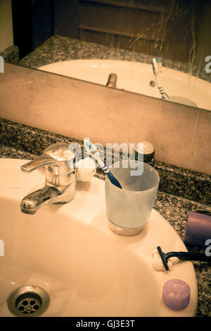 Bathroom sink in messy condition, a single male lifestyle concept Stock Photo