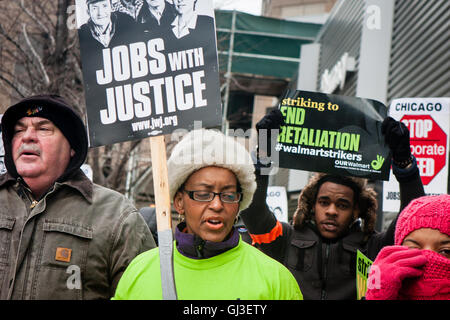 Chicago, Illinois - November 28, 2014: Striking Walmart workers and supporters protest outside a store on Black Friday. Stock Photo