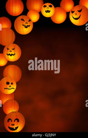 A collection of Halloween paper lanterns on a background with plenty of copy space. Stock Photo