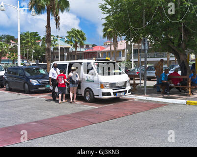 dh Marigot ST MARTIN CARIBBEAN Tourist taxi two women tourists and taxi rank minibus driver Stock Photo