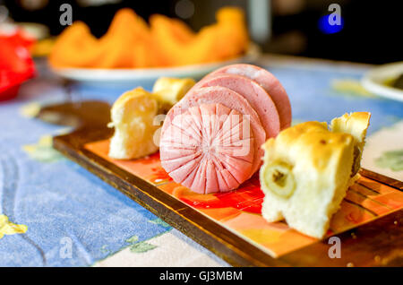 Mortadella bologna sausage with focaccia with olives Stock Photo