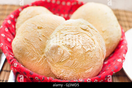 loaves freshly baked homemade bread red basket Stock Photo