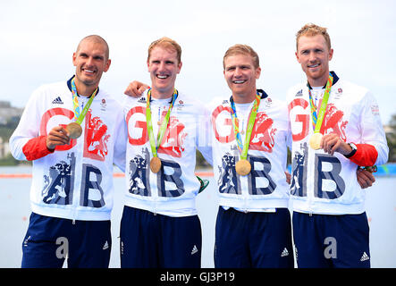 (left to right) Great Britain's Alex Gregory, Mohamed Sbihi, George Nash and Constantine Louloudis celebrating winning the gold medal in the Men's Four Final at The Lagoa Stadium on the seventh day of the Rio Olympic Games, Brazil. Picture date: Friday August 12, 2016. Photo credit should read: Mike Egerton/PA Wire. RESTRICTIONS - Editorial Use Only. Stock Photo