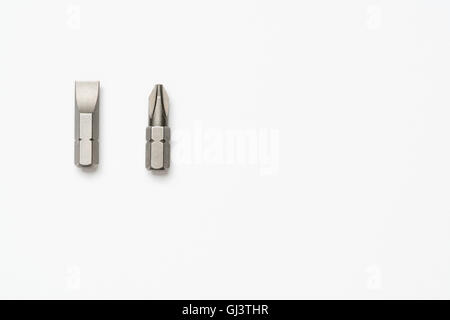 Choices: Phillips number 2 or flathead screwdriver bits on a white background Stock Photo