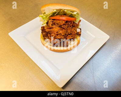Gaudidoun burger at B & O's Kitchen and Grocery. Pulled pork with BBQ sauce, boudin balls and burger fixins on a bun. SW Louisia Stock Photo