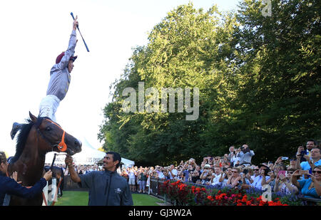 Frankie Dettori celebrates after riding Ghayyar to victory in The NGK Spark Plugs EBF Stallions Maiden Stakes at Newmarket Racecourse. Stock Photo