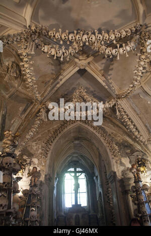 July 30, 2016 - Kutna Hora, Czech Republic - The Sedlec Ossuary ''Bone Church''.The Sedlec Ossuary is a small Roman Catholic chapel, located beneath the Cemetery Church of All Saints in Sedlec, a suburb of KutnÃ¡ Hora in the Czech Republic that displays some of the worldâ€™s more macabre art. It is one of twelve World Heritage Sites in the Czech Republic. The ossuary is estimated to contain the skeletons of between 40,000 and 70,000 people, whose bones have been artistically arranged to form decorations and furnishings for the chapel. The ossuary is among the most visited tourist attractions o Stock Photo