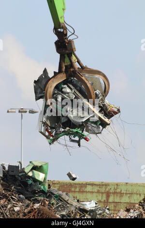 Crane with grab claw at scrap metal recycling yard, Hamburg Stock Photo