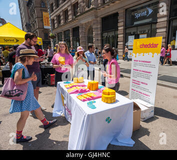 Cheddar, the streaming video service that provides business oriented news, holds a promotional event in Flatiron Plaza in New York on Friday, August 5, 2016. The web based service will stream live from a studio in the prow of the Flatiron Building as well as the New York Stock Exchange and NASDAQ. Cheddar is a premium subscription service and uses the Vimeo platform. Cheddar bills itself as the "CNBC for millennials".  (© Richard B. Levine) Stock Photo