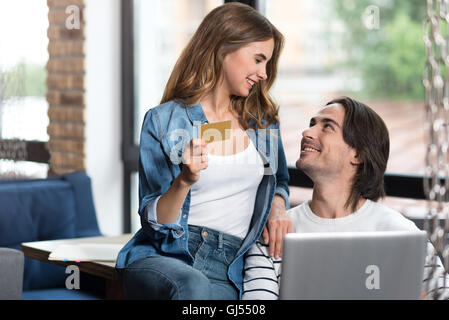 Delighted loving couple looking at each other Stock Photo