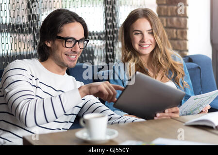 Cheerful colleagues using tablet Stock Photo