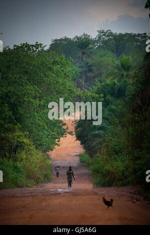 Makeni, Sierra Leone, Africa - June 06, 2013: Makeni, Bombali District North of Sierra Leone, the main dirt road Stock Photo