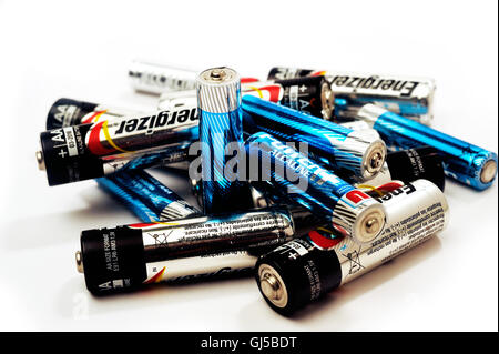 Recycling of used batteries of different brands on white background Stock Photo