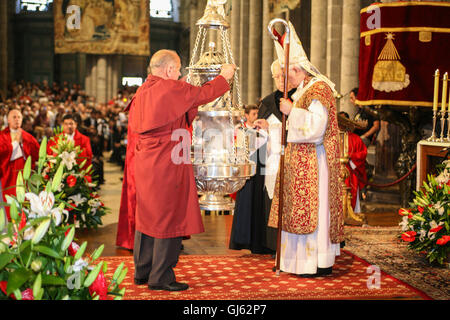 Service on July 25th, on St James Day at the altar of Santiago de Compostela Cathedral. Interior,Putting incense into the Botafumeiro, Stock Photo