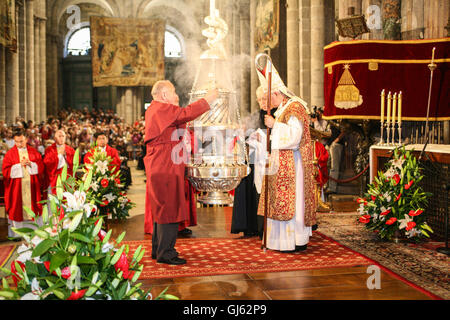 Service on July 25th, on St James Day at the altar of Santiago de Compostela Cathedral. Putting incense into the Botafumeiro, interior, Stock Photo