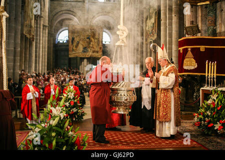 Service on July 25th, on St James Day at the altar of Santiago de Compostela Cathedral. Interior,Putting incense into the Botafumeiro, Stock Photo