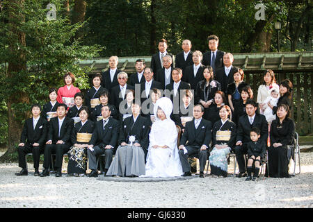 After the traditional Japanese Shinto wedding ceremony a formal portrait sitting takes place, at Meiji Jingu Shrine; near Haraju Stock Photo