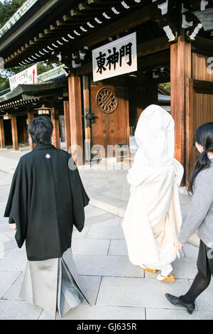 At a traditional Japanese Shinto wedding ceremony, after the wedding ceremony and after a formal portrait sitting,the bride and Stock Photo