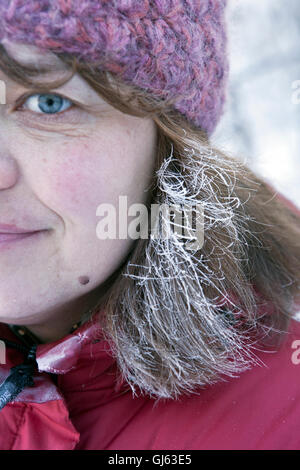 Womans profile with frost covered hair Stock Photo